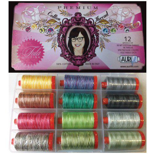 Set of colorful thread spools in a box with a pink label featuring a woman's face.
