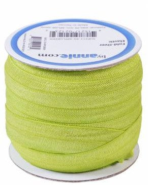 Spool of green thread with a label on a white background