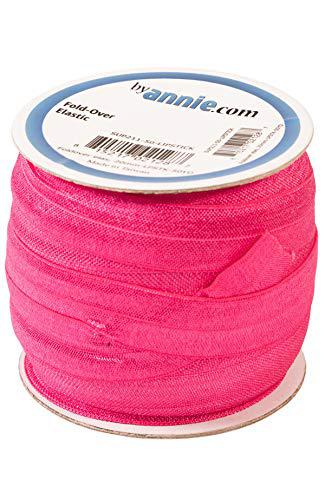 Spool of pink elastic thread with 'By Annie' label on a white background