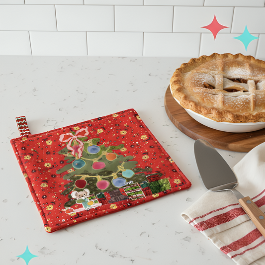 Red potholder with Christmas tree design next to a pie on a white surface