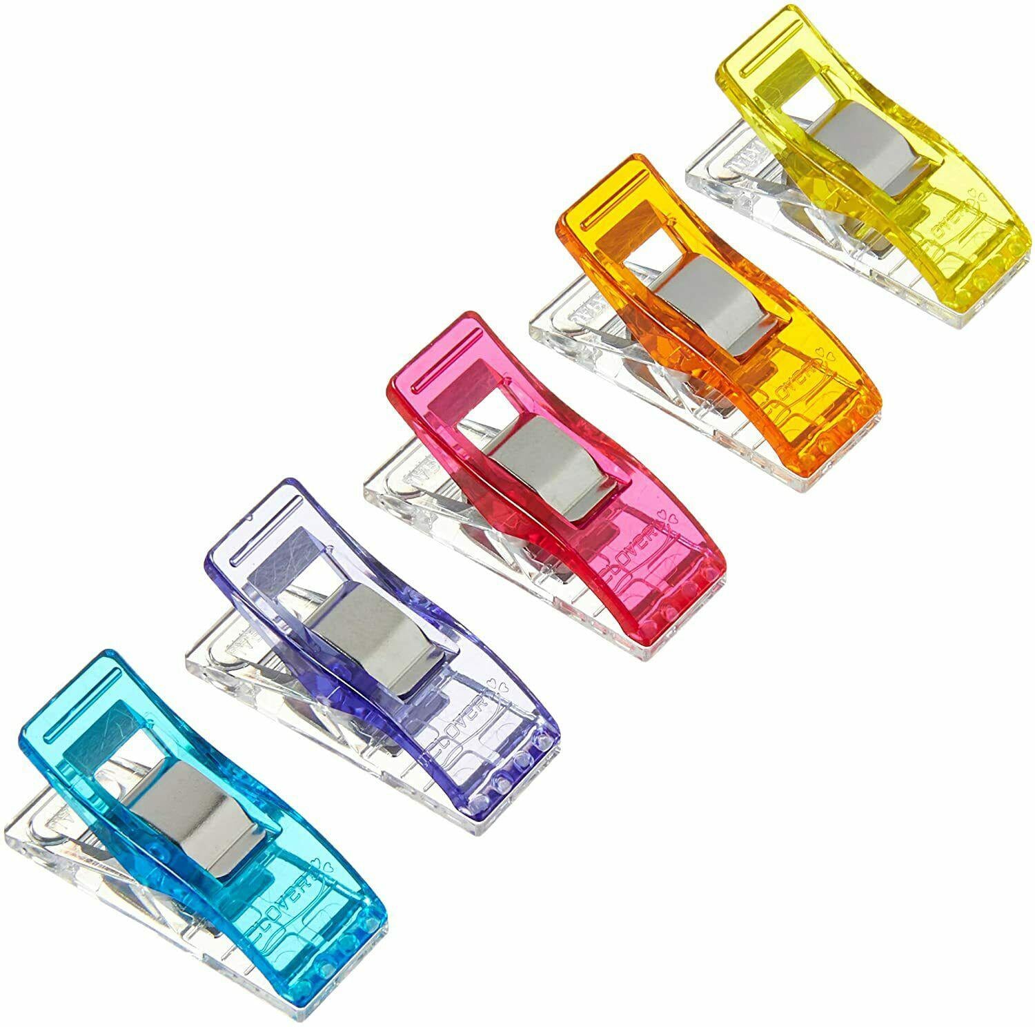 Set of colorful plastic clips on a white background