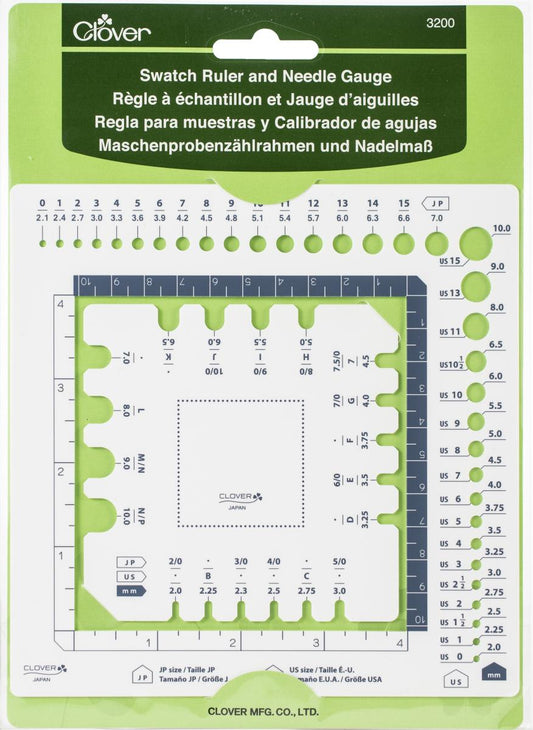 Clover swatch ruler and needle gauge on a green background