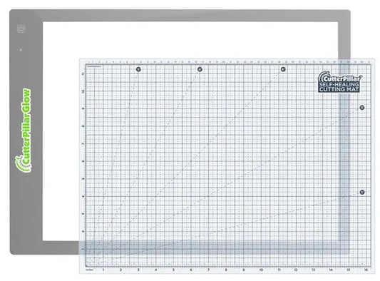 Self-healing cutting mat with grid pattern and brand logo on a white background