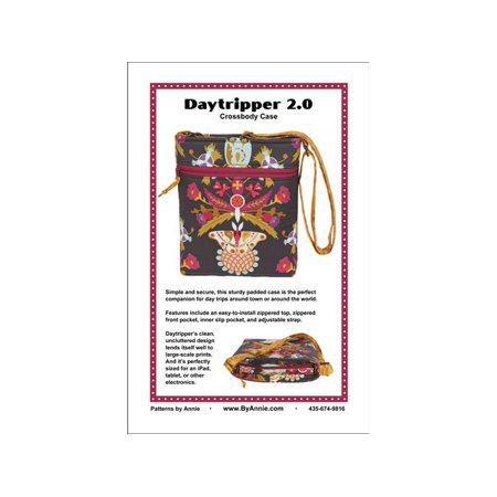 Daytripper 2.0 crossbody case with colorful embroidery on a white background