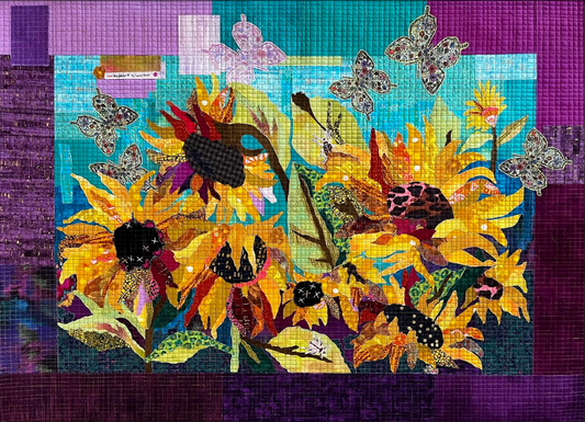 Facing the Sun collage quilt pattern by Laura Heine featuring a vibrant sunburst design