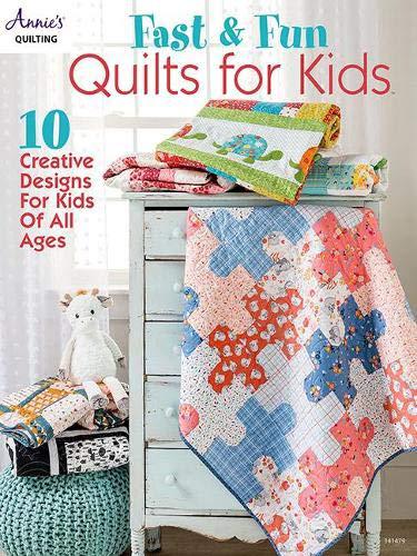 Book cover of 'Fast & Fun Quilts for Kids' with colorful quilts and a stuffed animal on a wooden table.