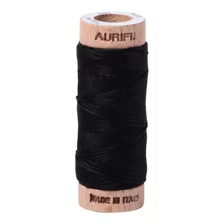 Spool of black thread with 'Aurifil' branding on a white background