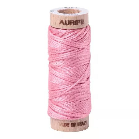 Spool of pink thread with 'Aurifil' branding on a white background
