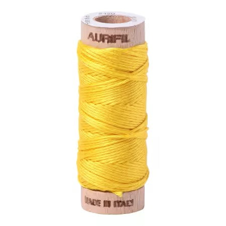 Spool of yellow thread on a white background with 'Aurifil' branding.