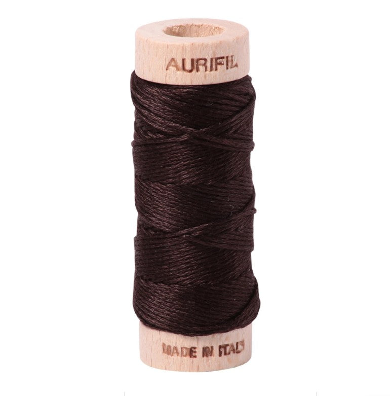 Spool of Aurifil thread on a white background