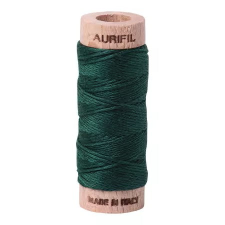 Spool of green thread with wooden spool and 'Aurifil' branding on a white background
