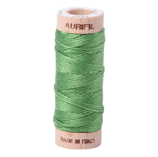 Spool of green thread with Aurifil branding on a white background