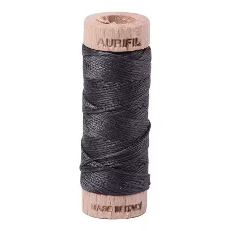 Spool of Aurifil thread on a white background