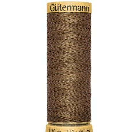 Spool of Gütermann thread on a white background