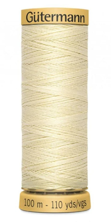 Spool of Gutermann thread on a white background