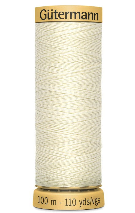 Spool of Gutermann thread on a white background