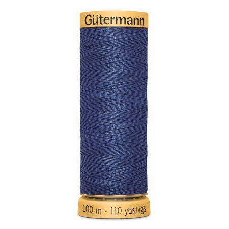 Spool of Gutermann thread on a white background