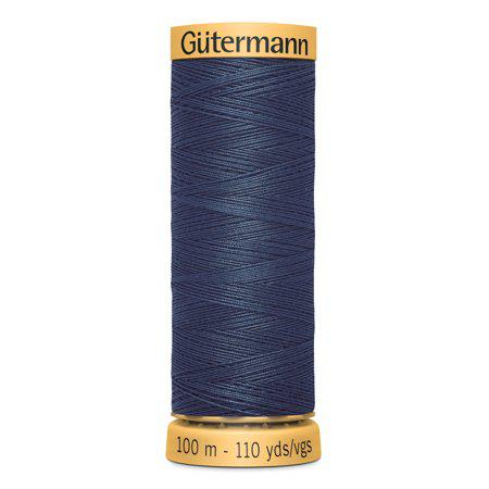 Spool of Gutermann thread on a white background