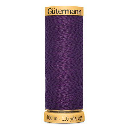 Spool of purple thread with 'Gütermann' branding on a white background