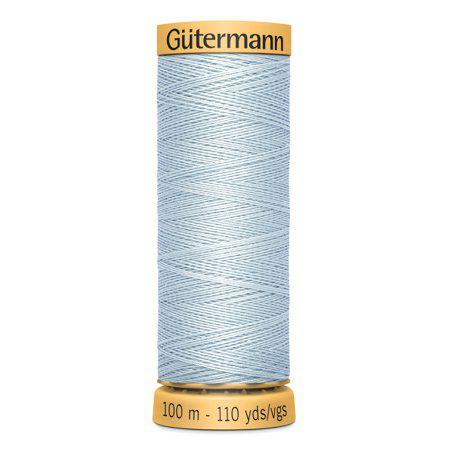 Spool of Gutermann thread on a white background