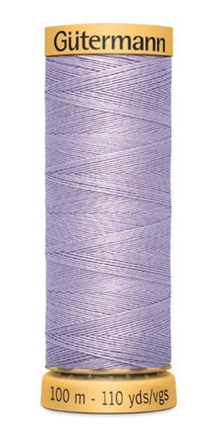 Spool of Gutermann thread on a white background