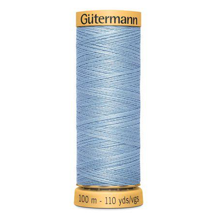 Spool of Gutermann thread on a white background