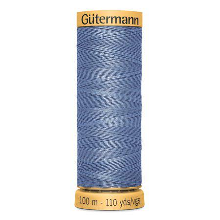 Spool of Gutermann thread on a white background