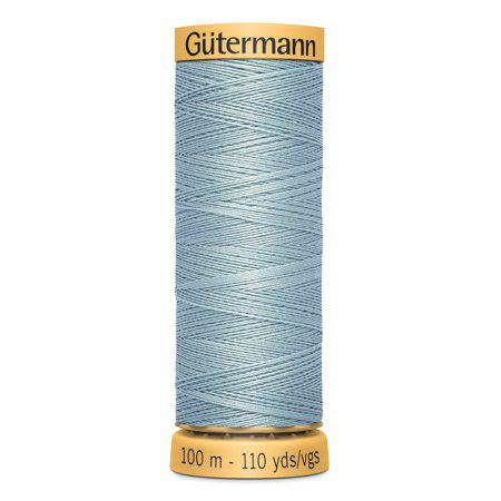 Spool of Gutermann thread on a white background