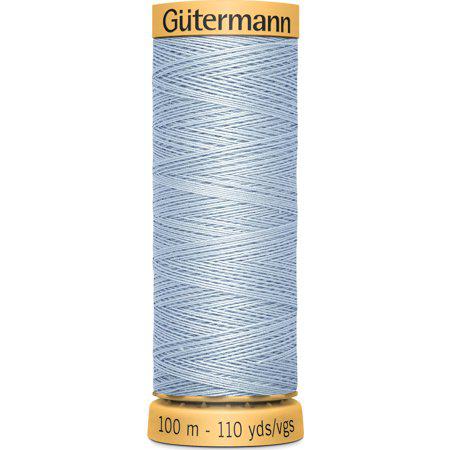 Spool of Gutermann thread on a white background