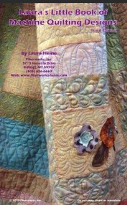 Book cover of 'Laura's Little Book of Machine Quilting Designs' with quilted fabric design.