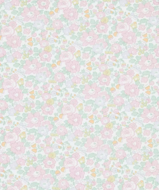 Pattern of small pink flowers on a light green background