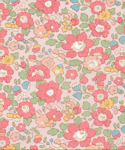 Pastel floral pattern on a pink background