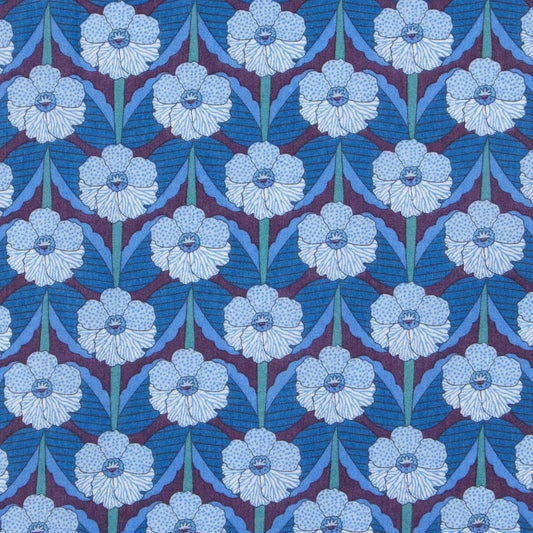 Patterned fabric with blue and white floral design on a blue background