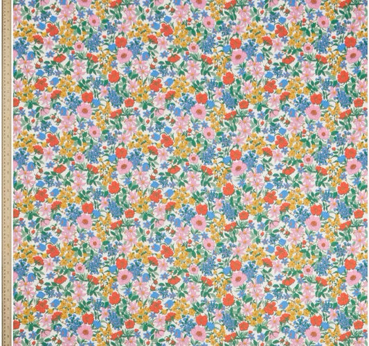 Floral patterned paper with small flowers in various colors on a white background