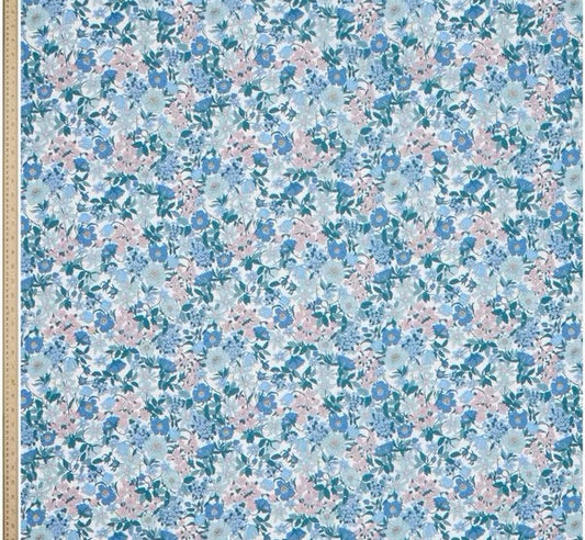 Floral patterned paper with blue and pink flowers on a light blue background