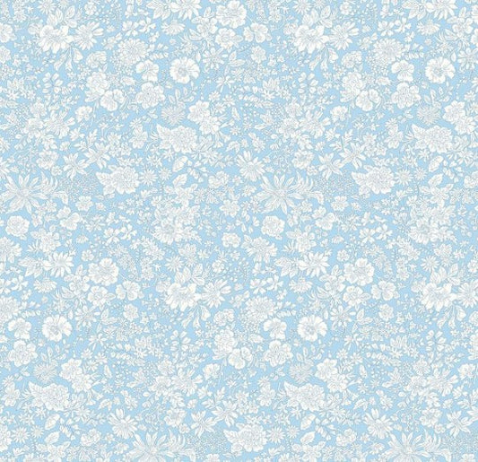 Pattern of small white flowers on a light blue background