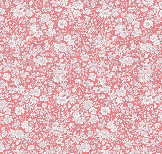 White floral pattern on a pink background
