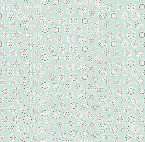 Mint Christmas fabric with white geometric snowflake pattern from Liberty Fabrics.