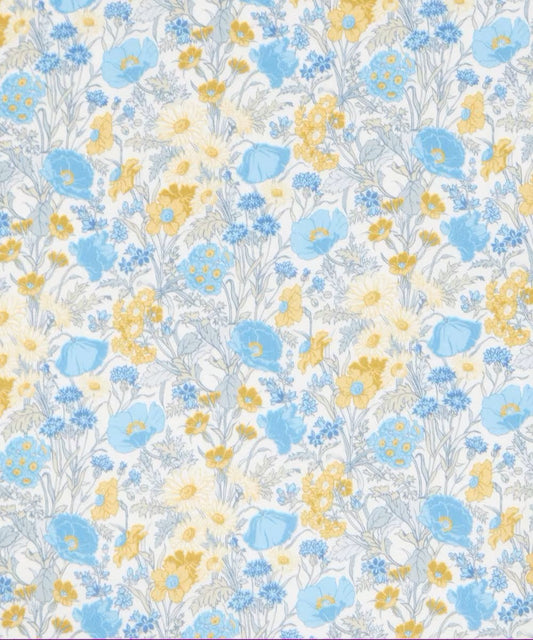 Floral pattern with blue and yellow flowers on a white background