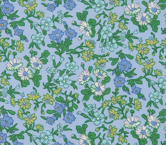 Floral pattern with blue, green, and white flowers on a light blue background