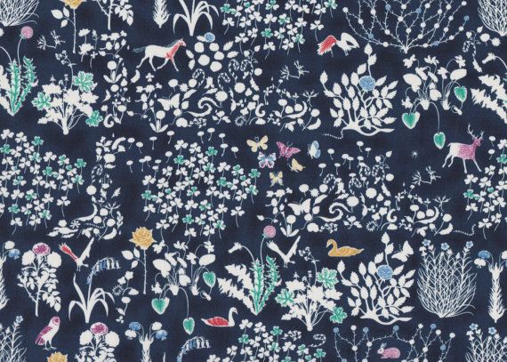 Navy blue fabric with white floral and animal pattern