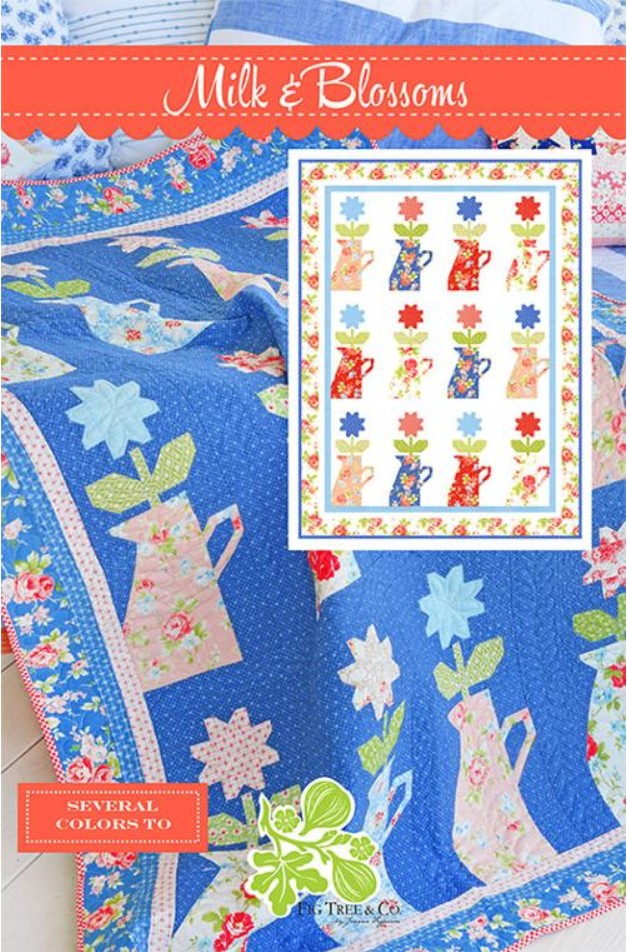 Quilt pattern with floral and cat designs on a blue background, featuring the brand 'Milk & Blossoms'.