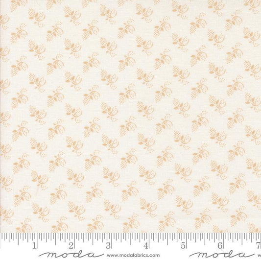 Fabric pattern with small floral design on a white background, featuring Moda label.