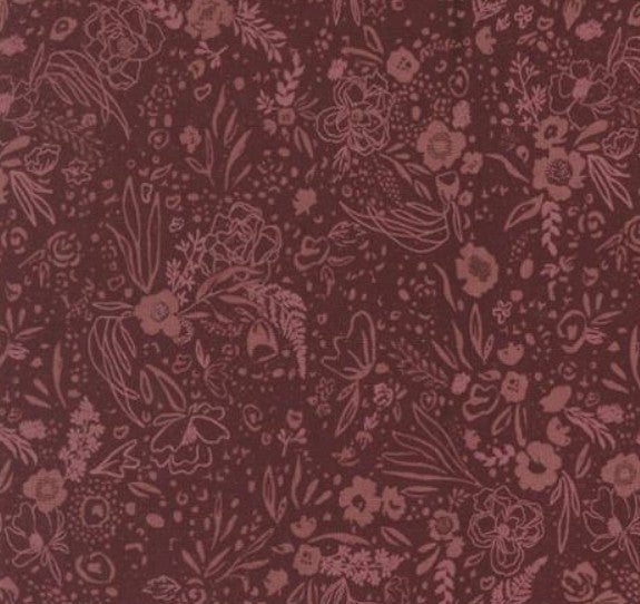 Dark red fabric with intricate floral and leaf pattern