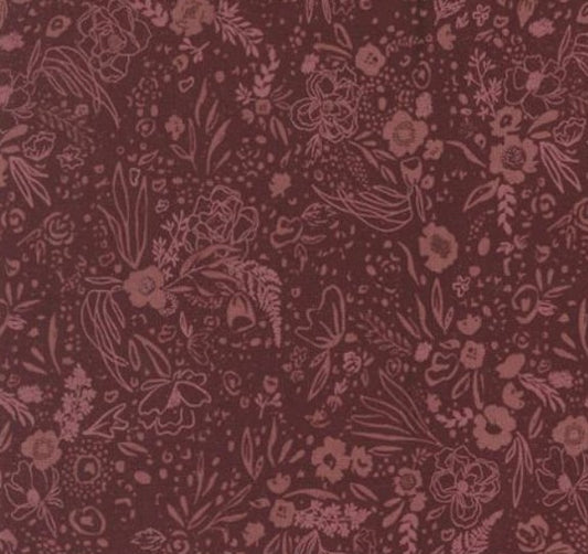 Dark red fabric with intricate floral and leaf pattern