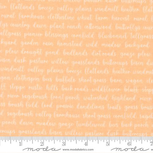Textured fabric with printed text on a peach background, featuring a ruler at the bottom.