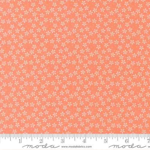 Fabric pattern with small white flowers on a coral background, featuring Moda label.