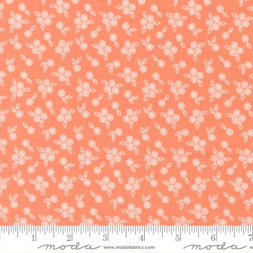 Floral pattern fabric swatch on a coral background with Moda label.