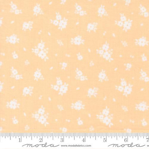 White floral pattern on a yellow background with Moda label.