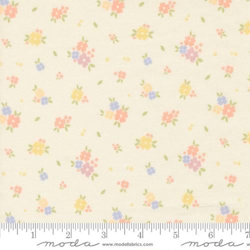 Floral pattern fabric with a ruler at the bottom for scale on a beige background